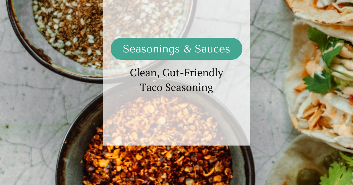 Bowls of taco seasoning blends next to fresh tacos on a marble background, with text overlay reading ‘Seasonings & Sauces – Taco Seasoning’