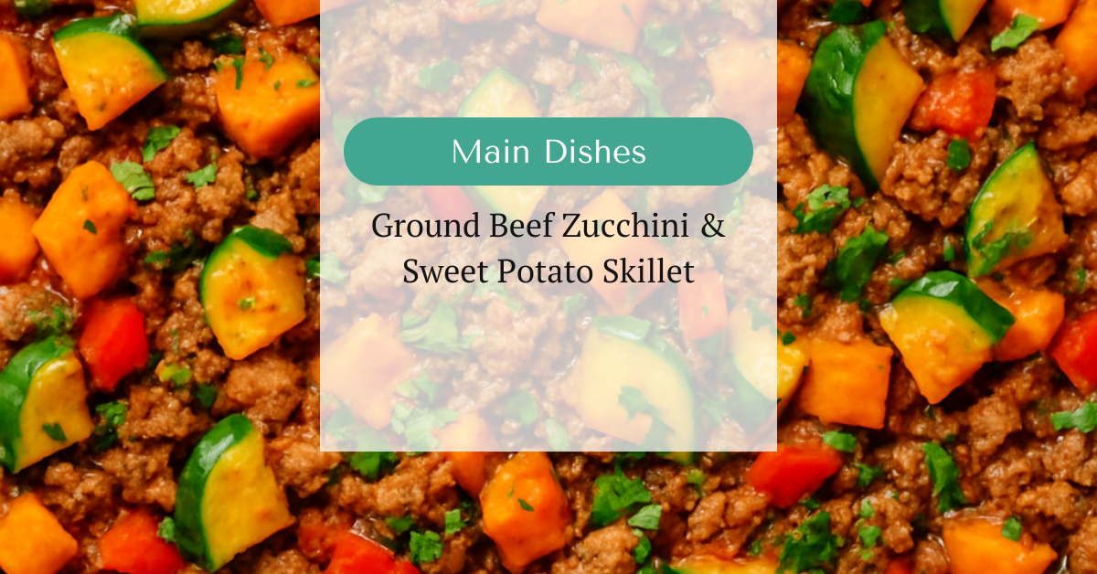 Hearty ground beef skillet with diced sweet potatoes, zucchini, red bell pepper, and a tomato-based sauce, topped with fresh parsley.