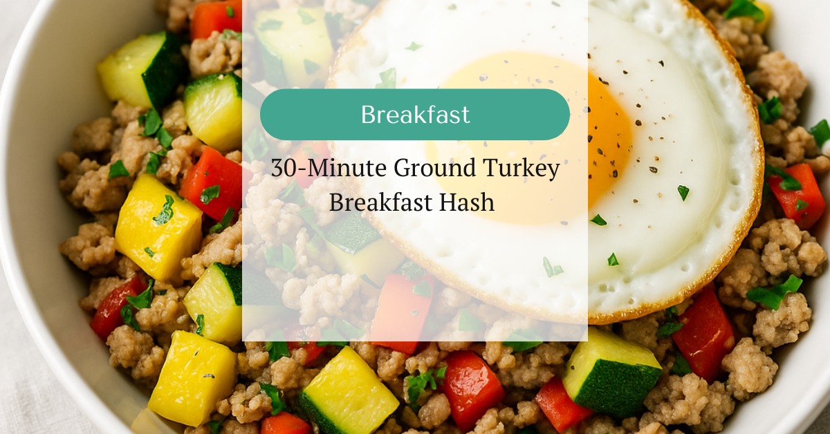 Ground turkey breakfast hash with zucchini, squash, bell pepper, and a sunny-side-up egg, served in a white bowl.