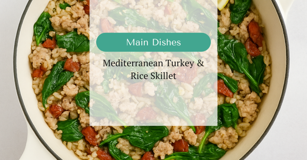 Overhead view of a Mediterranean turkey and rice skillet with sun-dried tomatoes and spinach in a white pan, with text overlay reading “Main Dishes – Mediterranean Turkey & Rice Skillet”