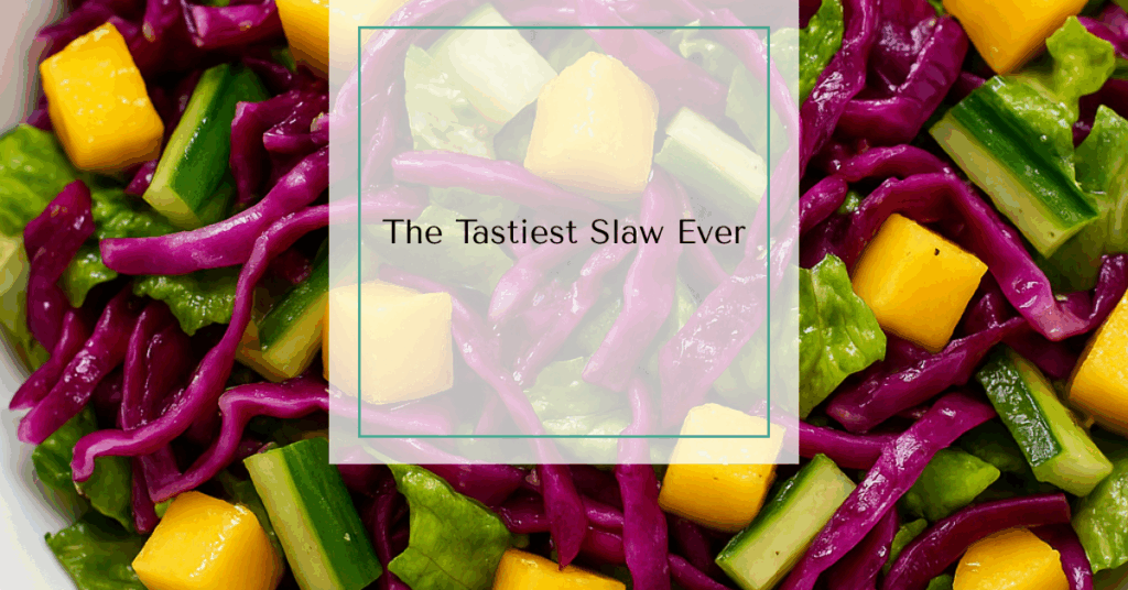 A vibrant slaw with red cabbage, mango, cucumber, and romaine lettuce tossed in a light vinaigrette.
