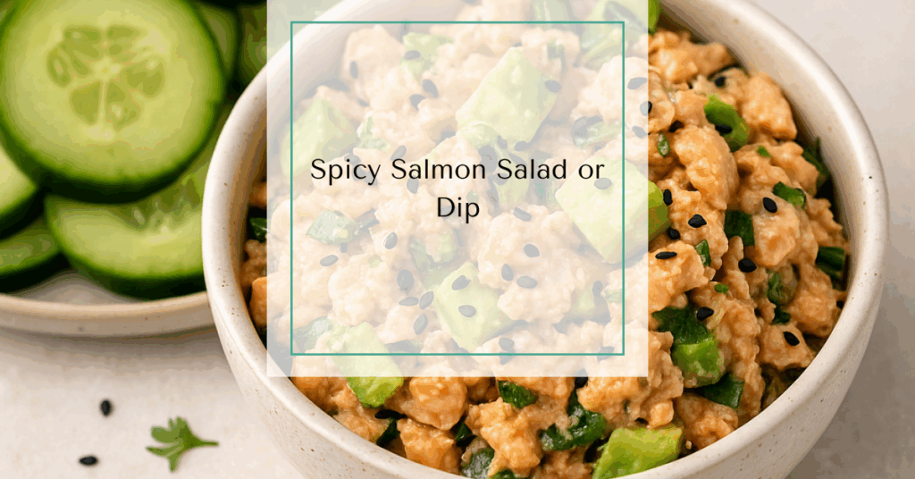 A bowl of spicy salmon salad garnished with avocado and herbs, surrounded by sliced cucumbers for dipping.