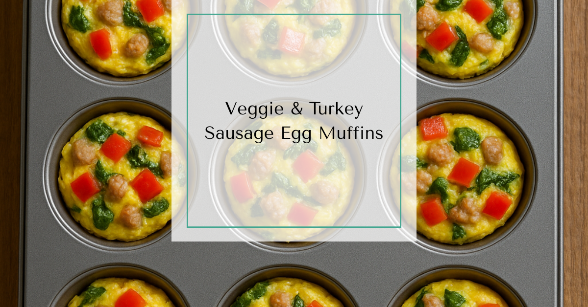Muffin tin filled with baked egg cups made with turkey sausage, spinach, and diced peppers on a wooden surface.