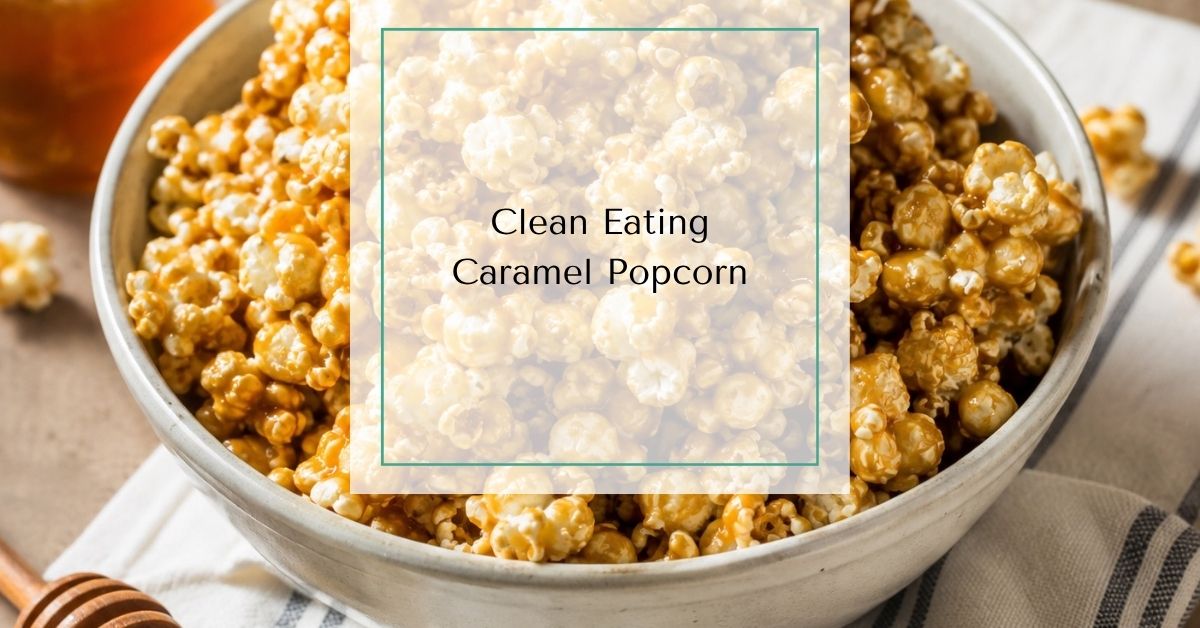 Homemade clean eating caramel popcorn coated with honey and nut butter in a ceramic bowl with text overlay reading “Clean Eating Caramel Popcorn”